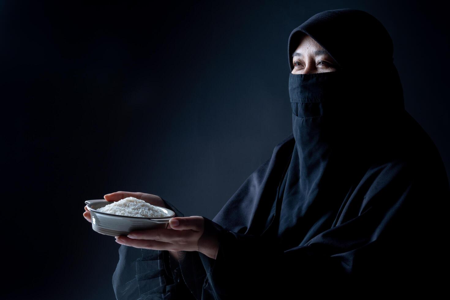 Hands are holding a pile of grain to zakat, the Islamic zakat concept. Muslims help the poor and needy. Conceptual shoot for property, income, and fitrah zakat. photo