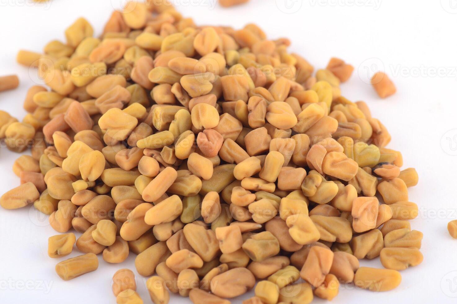 Fenugreek seeds isolated on white background photo