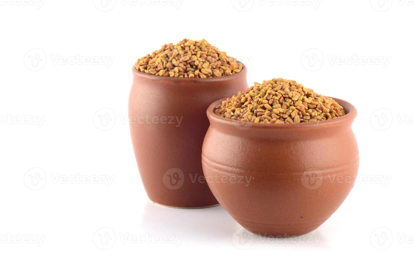 Two clay pots with food in them photo