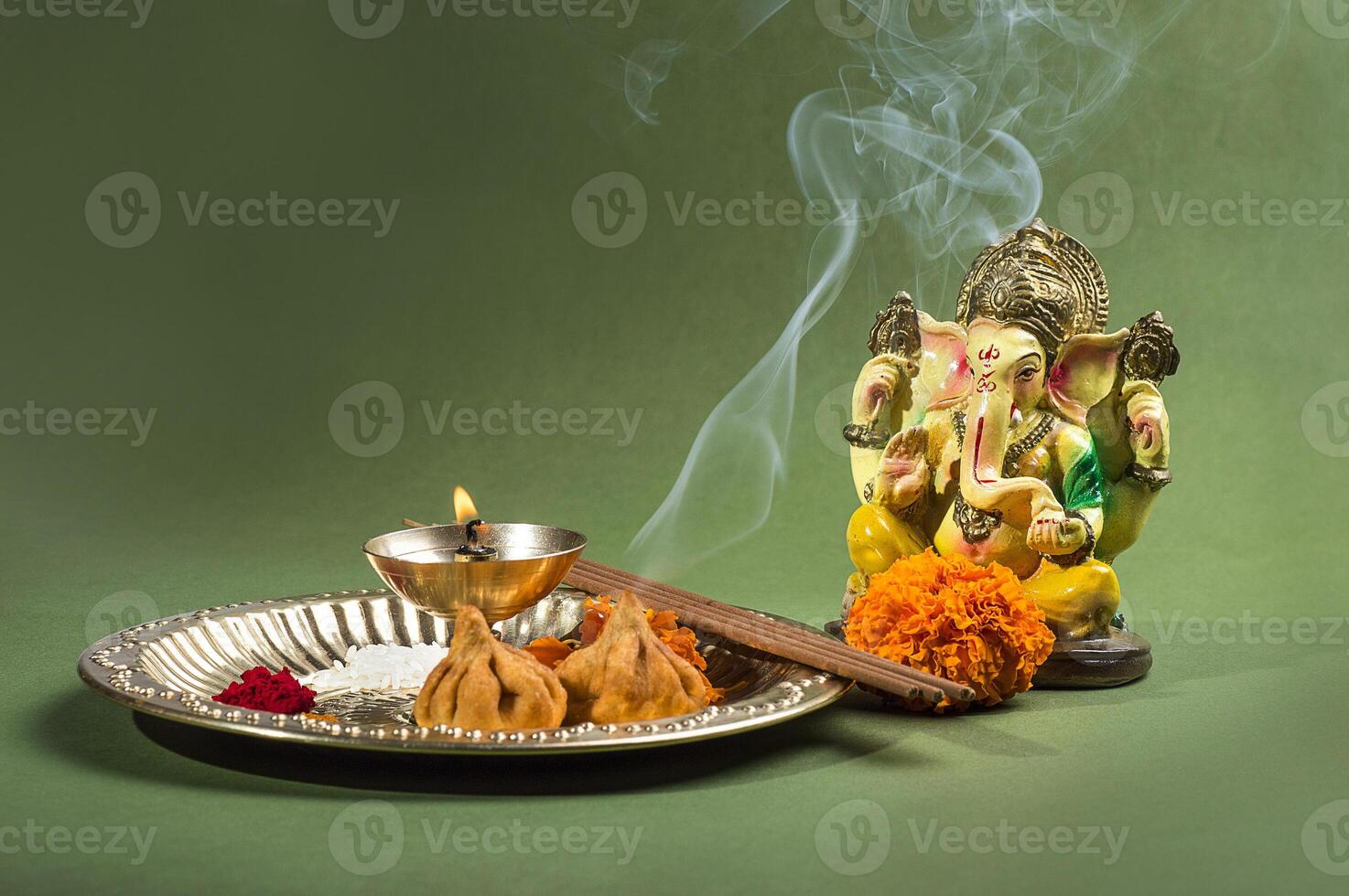 Hindu God Ganesha. Statue of Lord Ganesha. Worship arrangement. photo