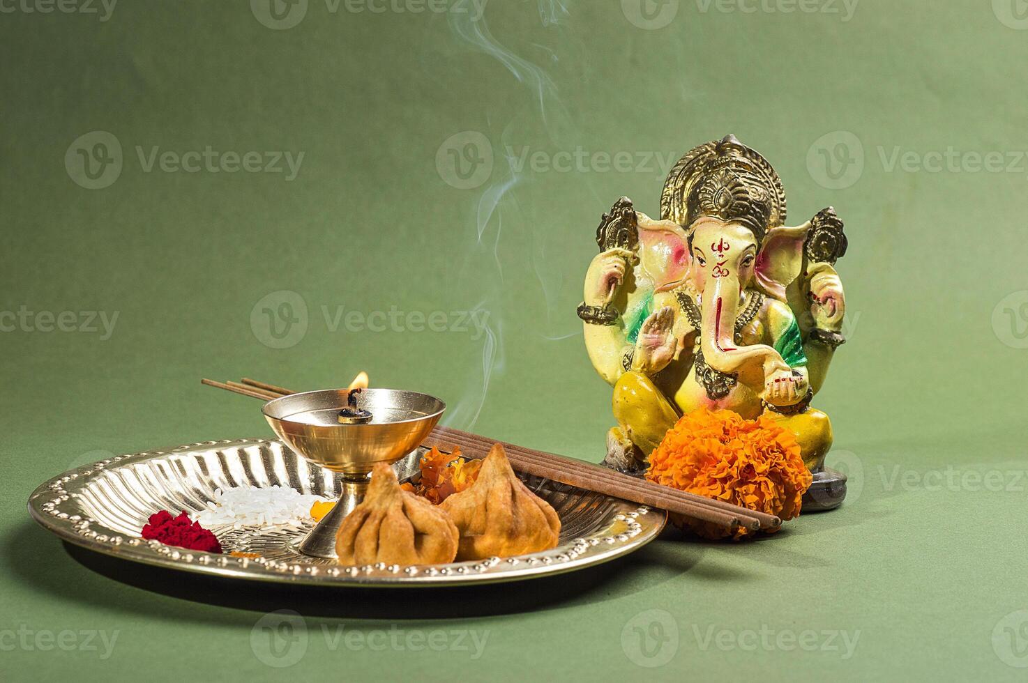 Hindu God Ganesha. Statue of Lord Ganesha. Worship arrangement. photo