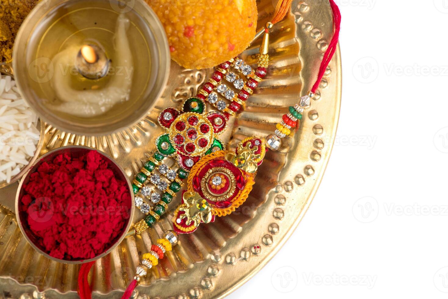 A plate with various colored rakhi and other items photo