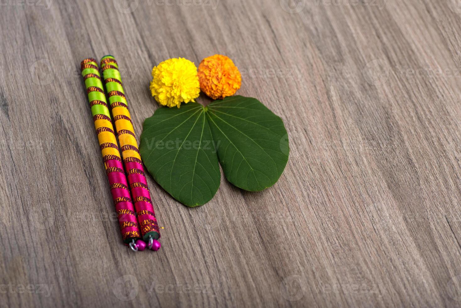 Two colorful pencils on a wooden table photo