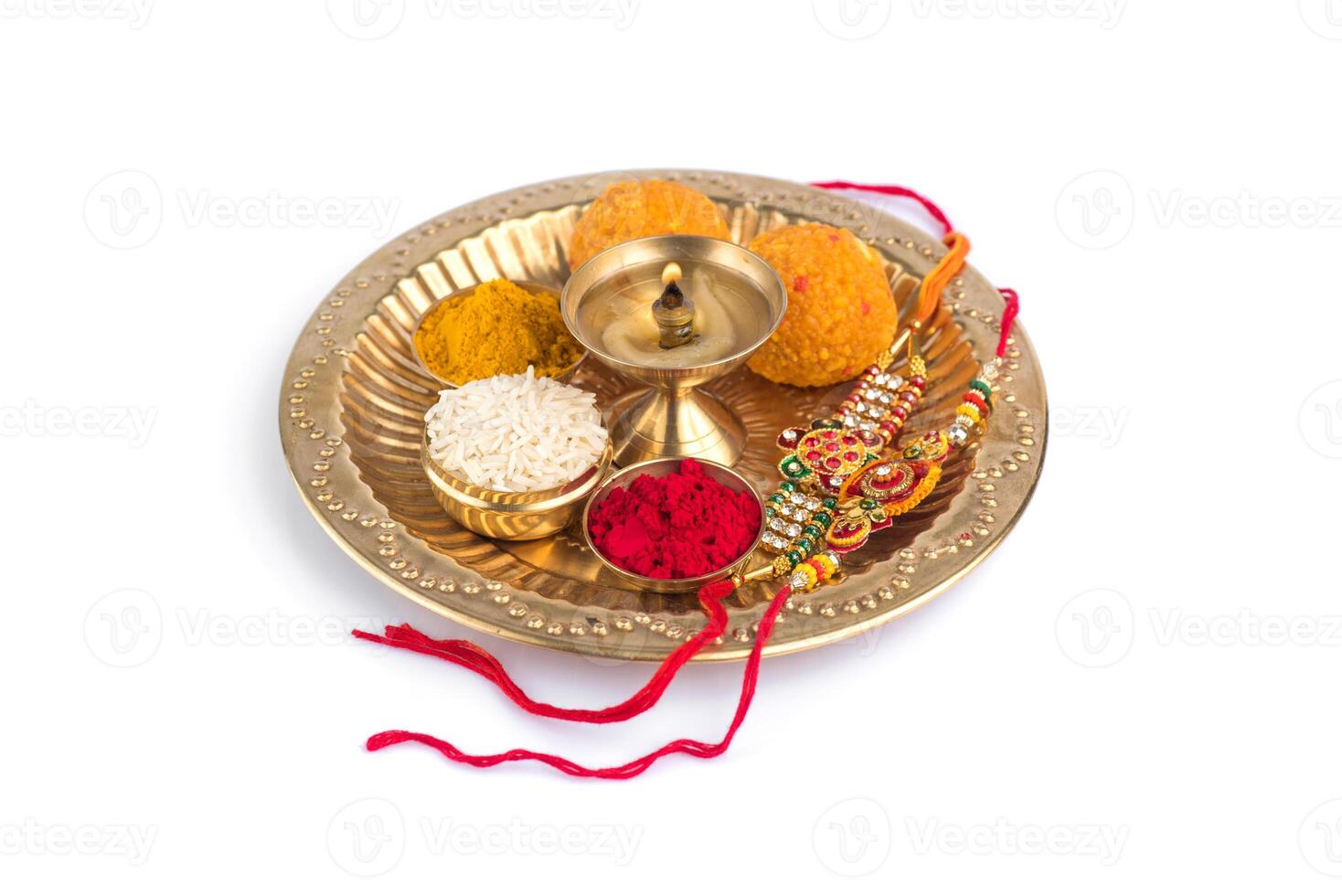 An image of a plate with various indian sweets photo