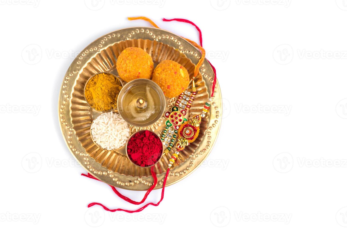 A plate with various colored rakhi on it photo