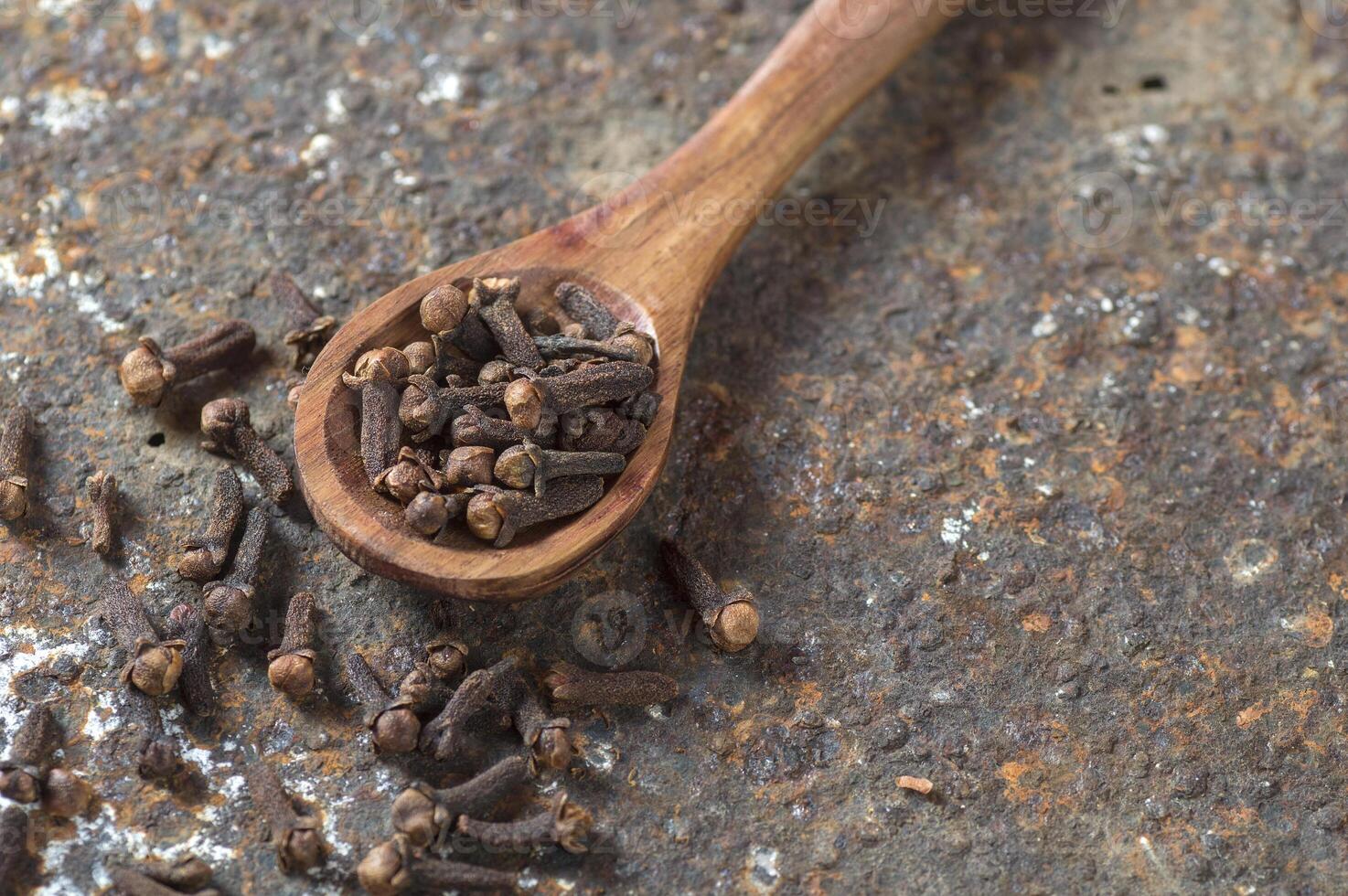 Cloves on a textured background. Spices, Food and cuisine ingredients. photo