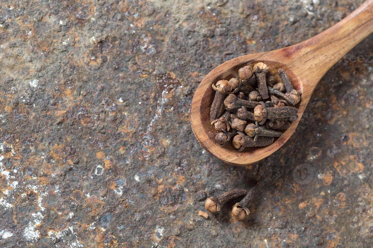 Cloves on a textured background. Spices, Food and cuisine ingredients. photo