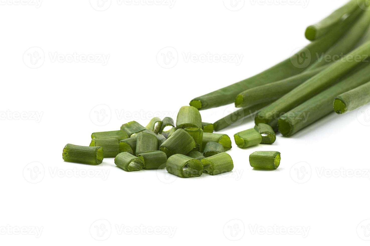 Fresh ripe green spring onions shallots or scallions with fresh chopped green onions on white background photo