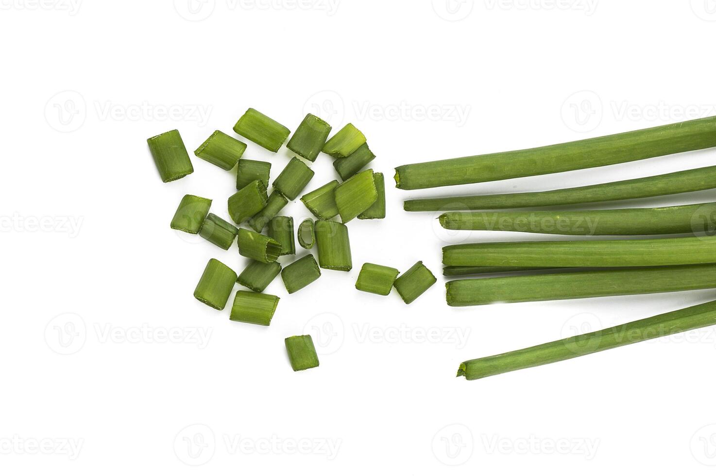 Fresh ripe green spring onions shallots or scallions with fresh chopped green onions on white background photo