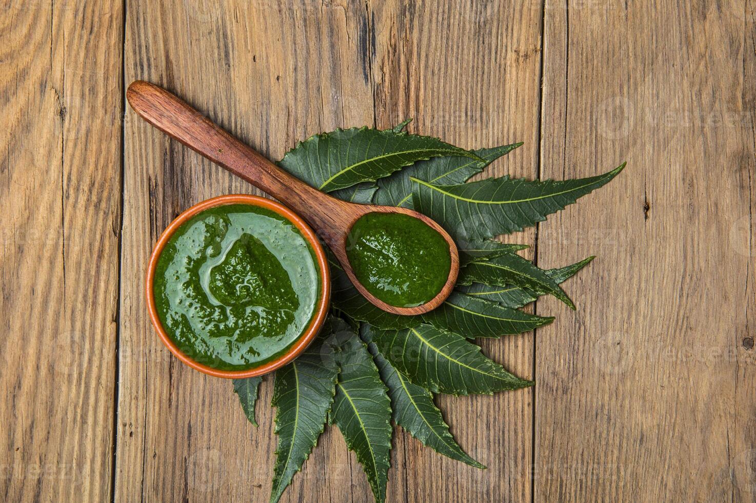 Mahua paste in a wooden bowl on a wooden table photo