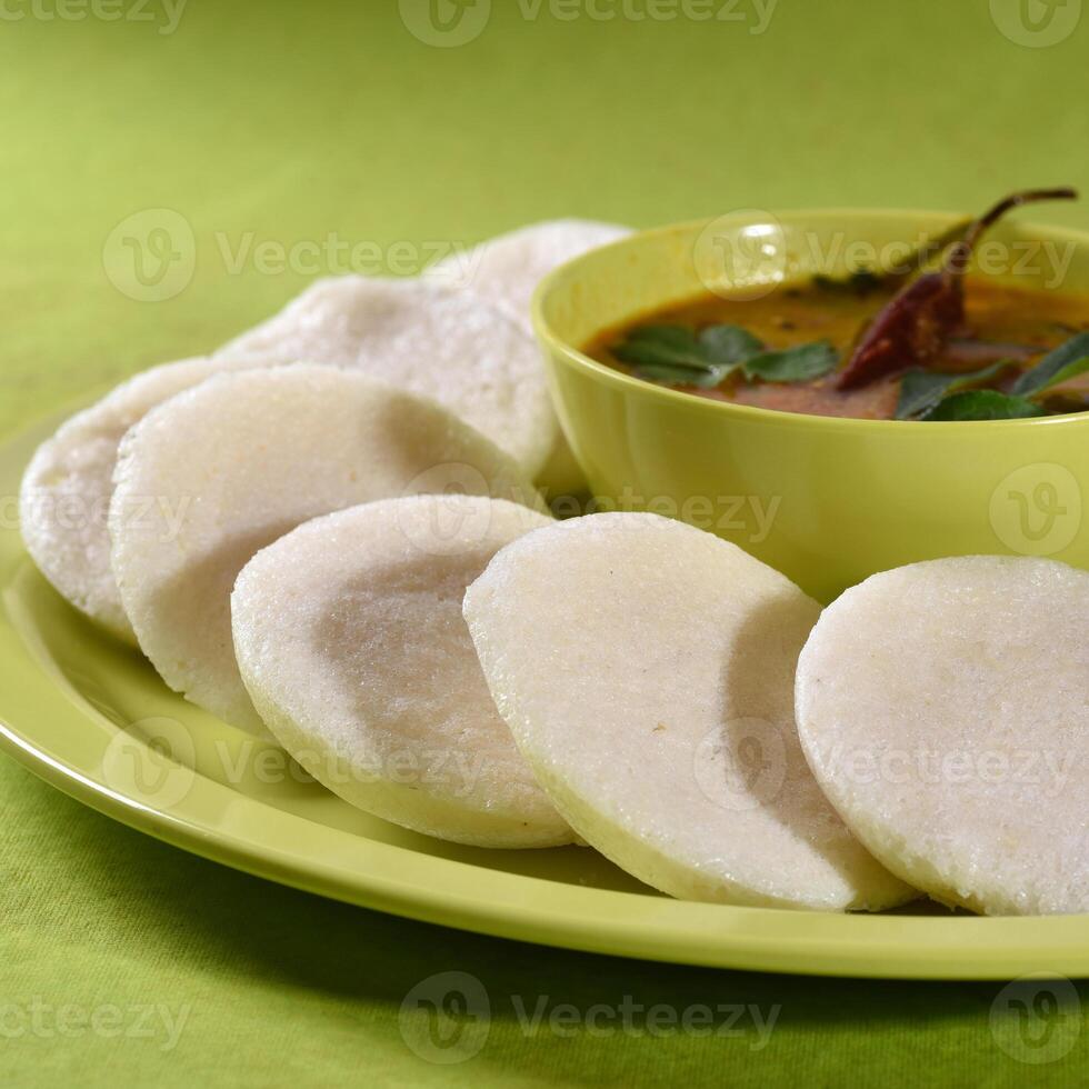 A plate of food with a bowl of soup on it photo