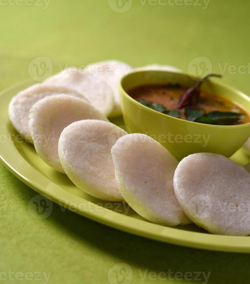 A plate with some small white dumplings on it photo
