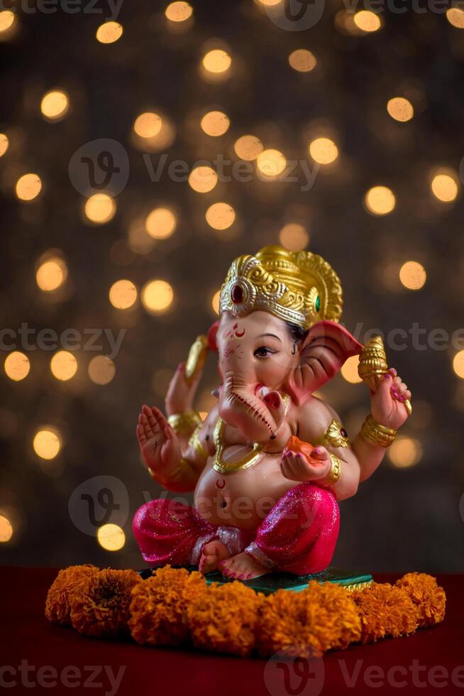Hindu God Ganesha on Blured bokeh background, Ganesha Idol. photo