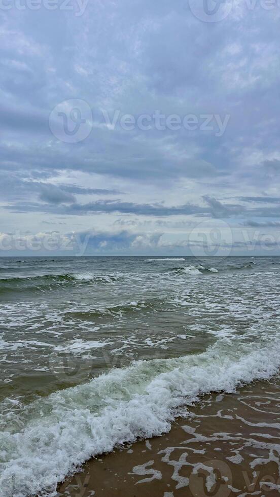 Waves rolling on the Baltic Sea coast. Seascape. Latvia photo