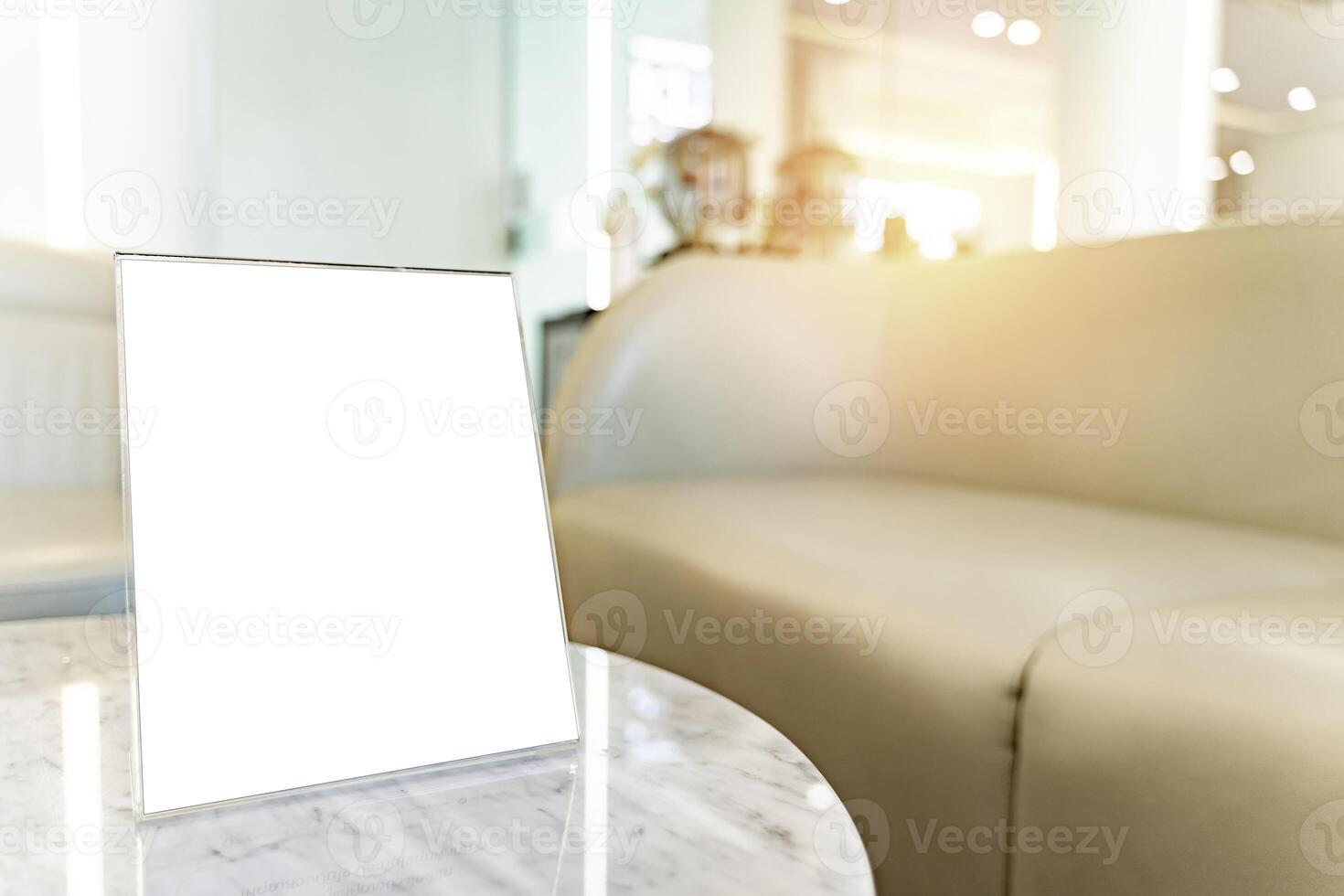 Plastic restaurant empty menu holder on white table with blurred image of hospital background, advertisement. photo