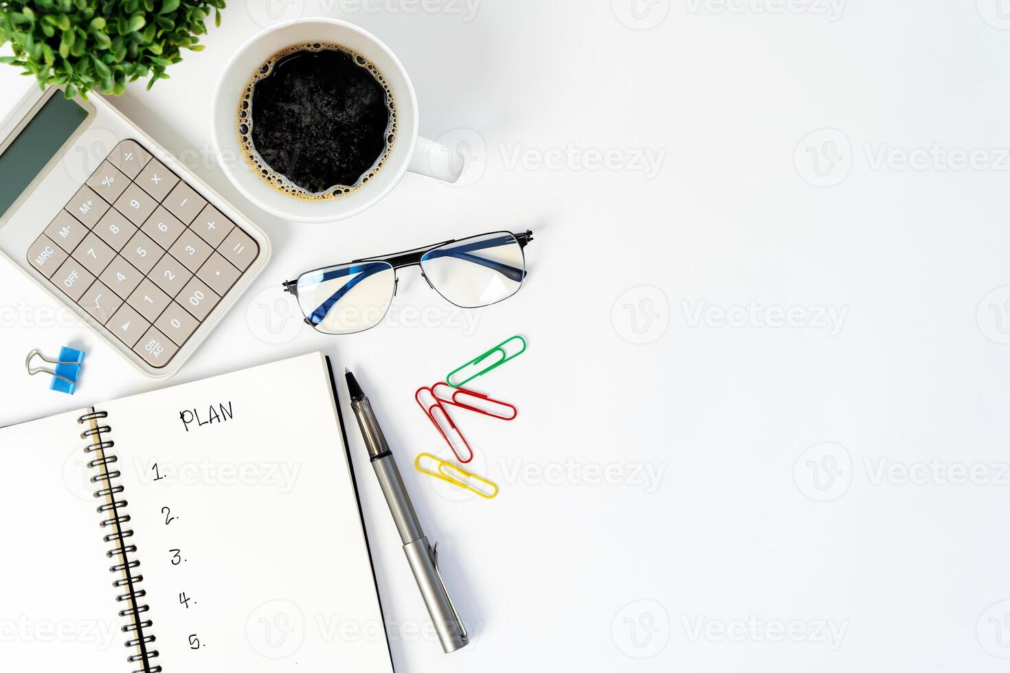 Plan words written in an office notebook. New challenges, new plans, time for a change. photo