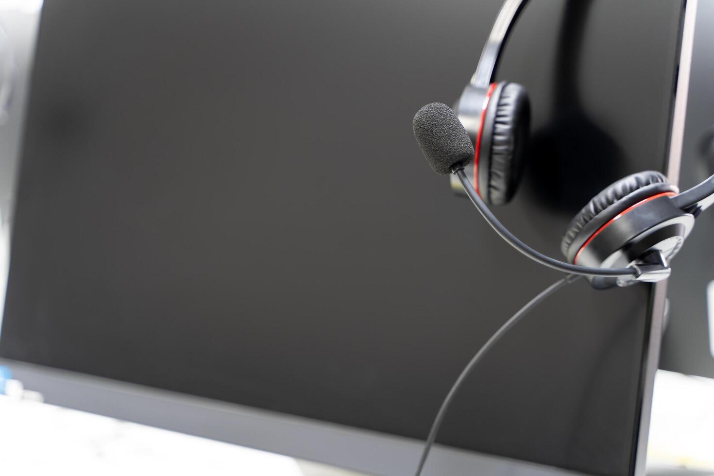 The microphone is used to pick up the agent's voice. The headset is a standard piece of equipment for call center agents photo
