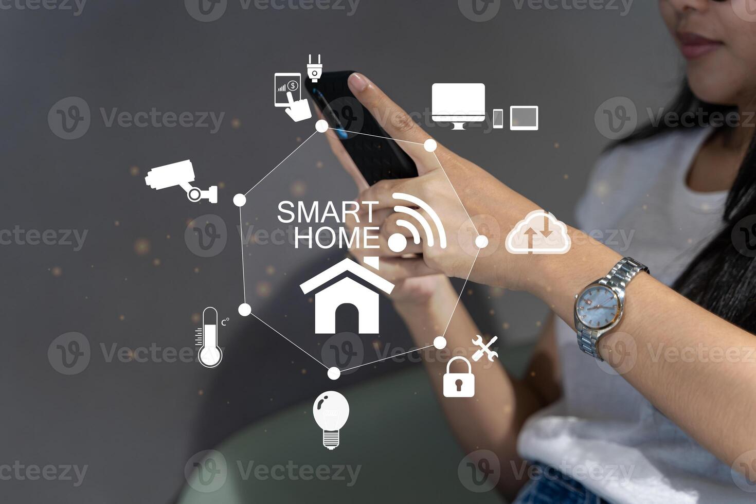 Woman's hands holding smartphone in bedroom with couple exposure of smart home interface, automation concept. Smart home automation control system. photo