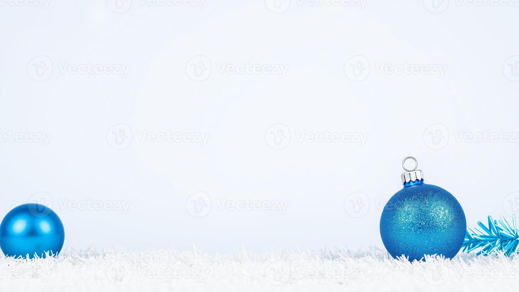 two blue ornaments on a white surface photo
