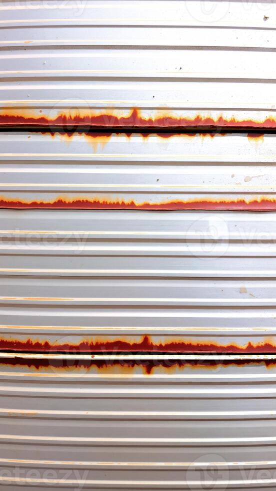 close- a corrugated metal surface with rust photo