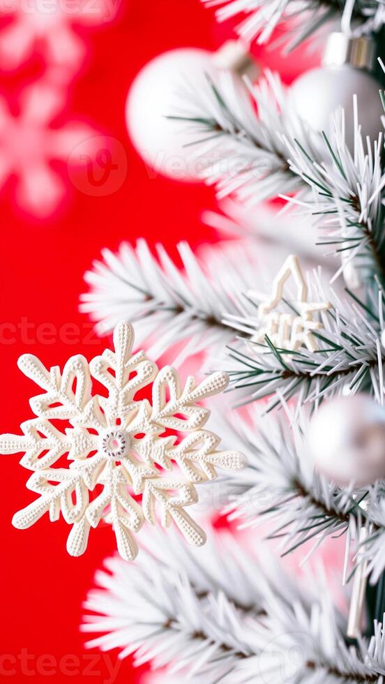 delicate white snowflake ornament adorns a snowy evergreen branch photo