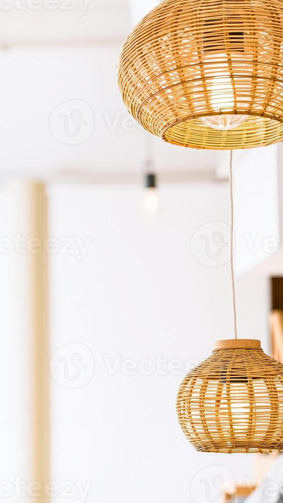 two woven light fixtures hanging from a ceiling photo