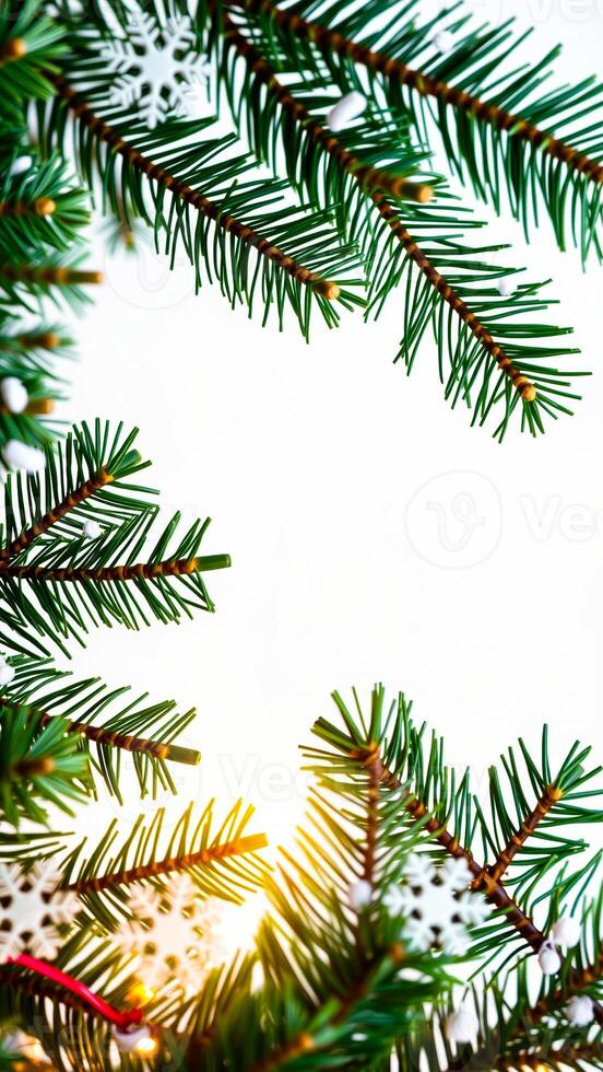 close- pine branches with snowflake ornaments photo