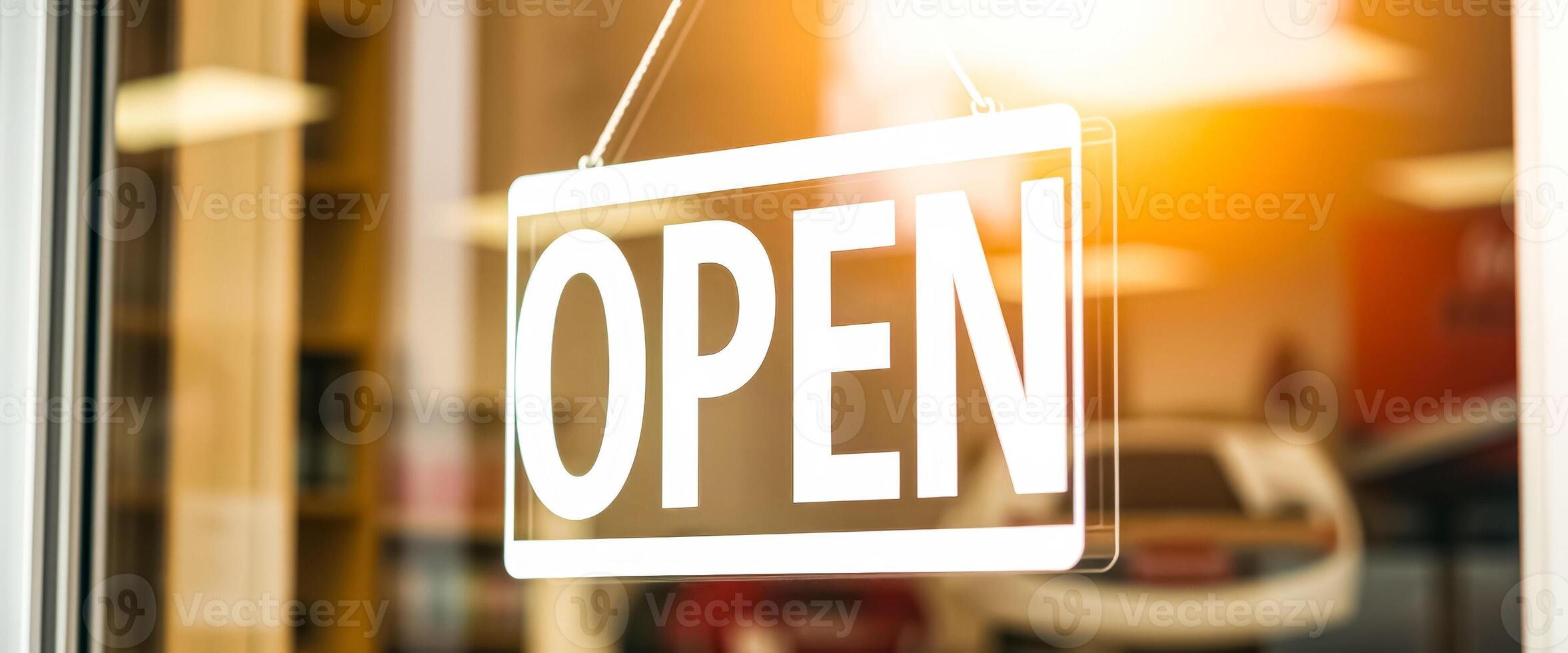 white open sign hangs a storefront window photo