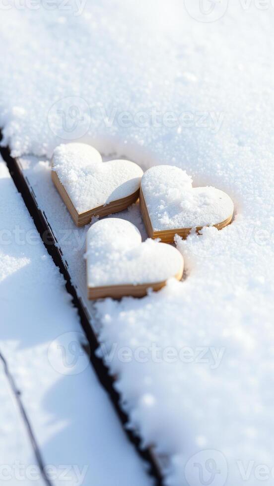 three snowy wooden hearts photo