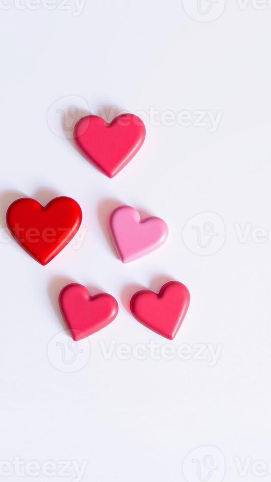five pink red hearts on a white background photo