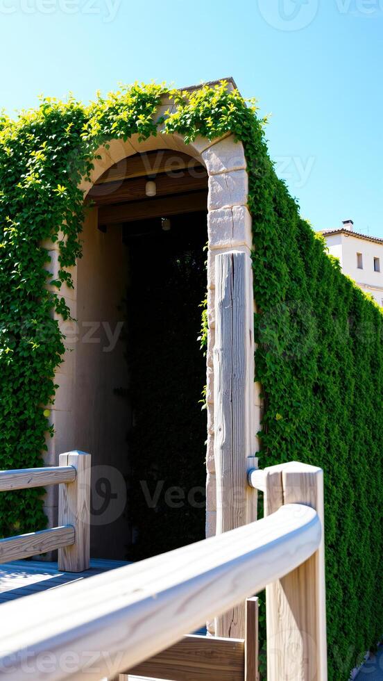 vine-covered archway leads a tranquil garden entrance photo
