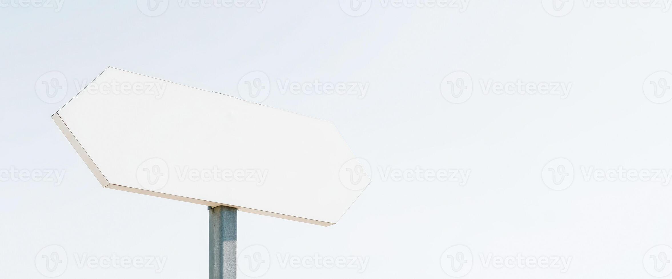 blank hexagonal sign against a pale blue sky photo