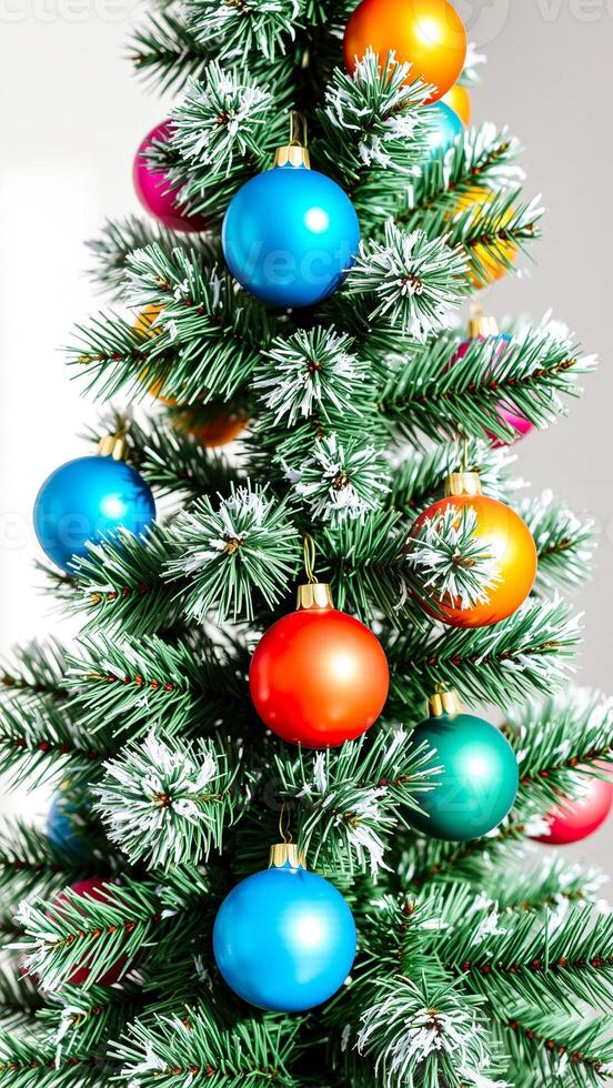 colorful ornaments adorn a frosted pine tree photo