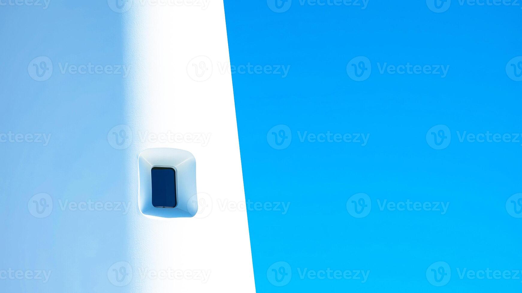white wall against a blue sky photo