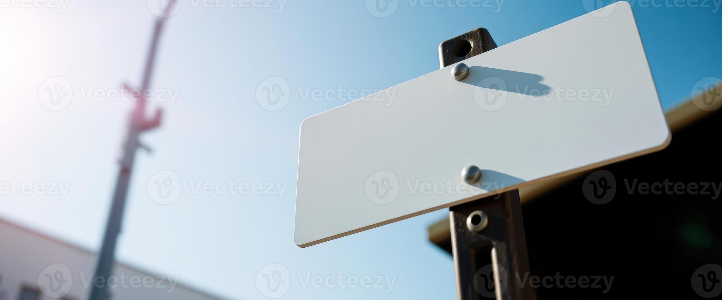 blank sign against a blue sky photo