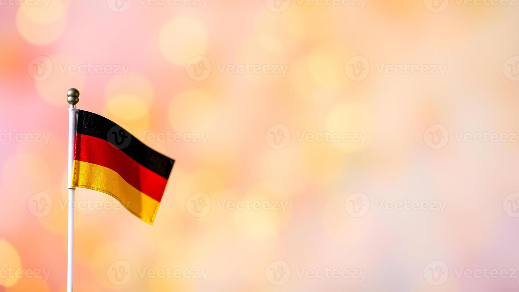 small flag representing a country with black red yellow colors photo