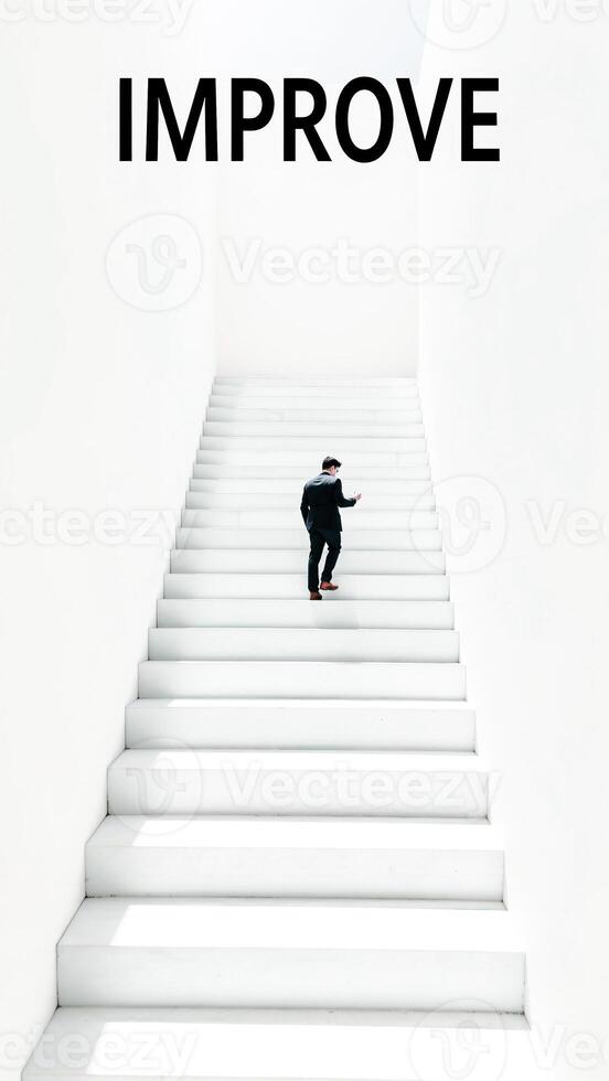 man ascending white steps towards improvement photo
