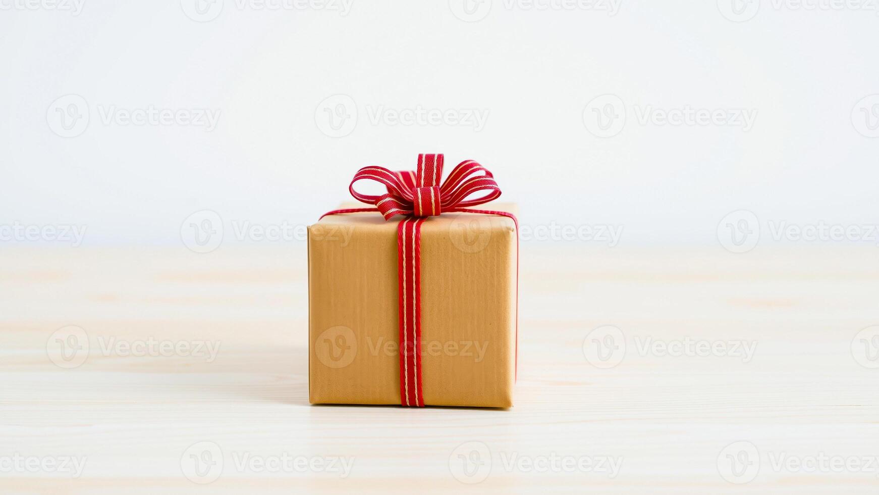 brown gift box with red ribbon photo