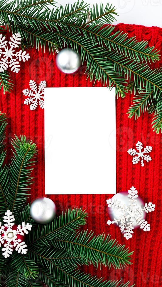 festive card decorated with evergreen branches silver ornaments snowflakes photo