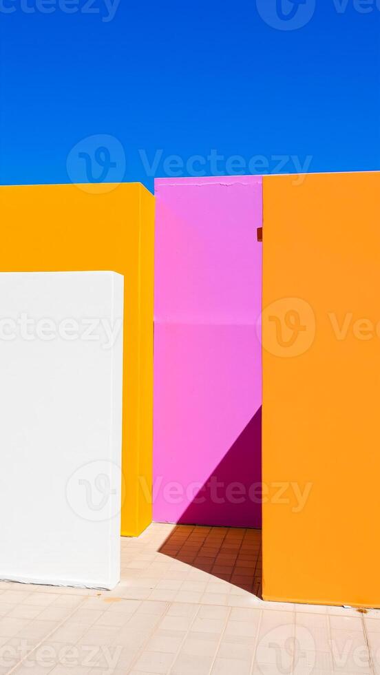three colorful walls against a blue sky photo
