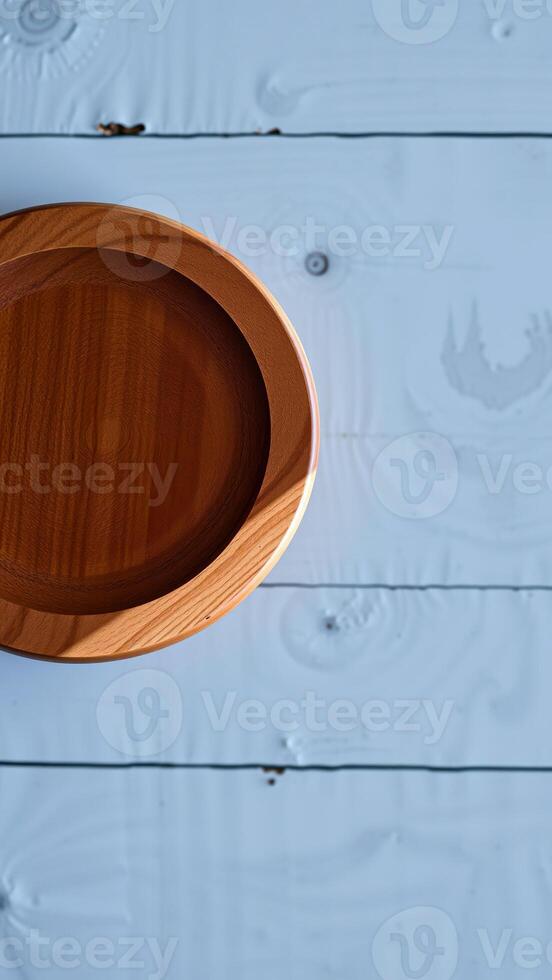round wooden bowl on a light-colored wood surface photo
