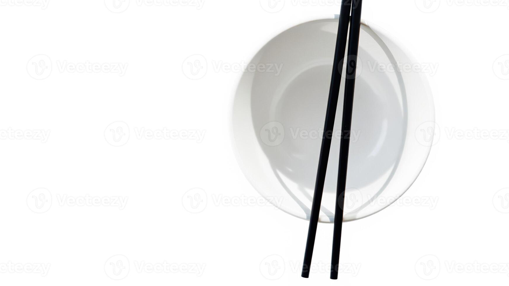 empty white bowl with black chopsticks photo