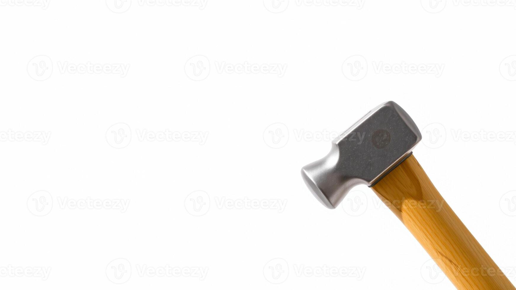 close- a silver hammer with a wooden handle photo