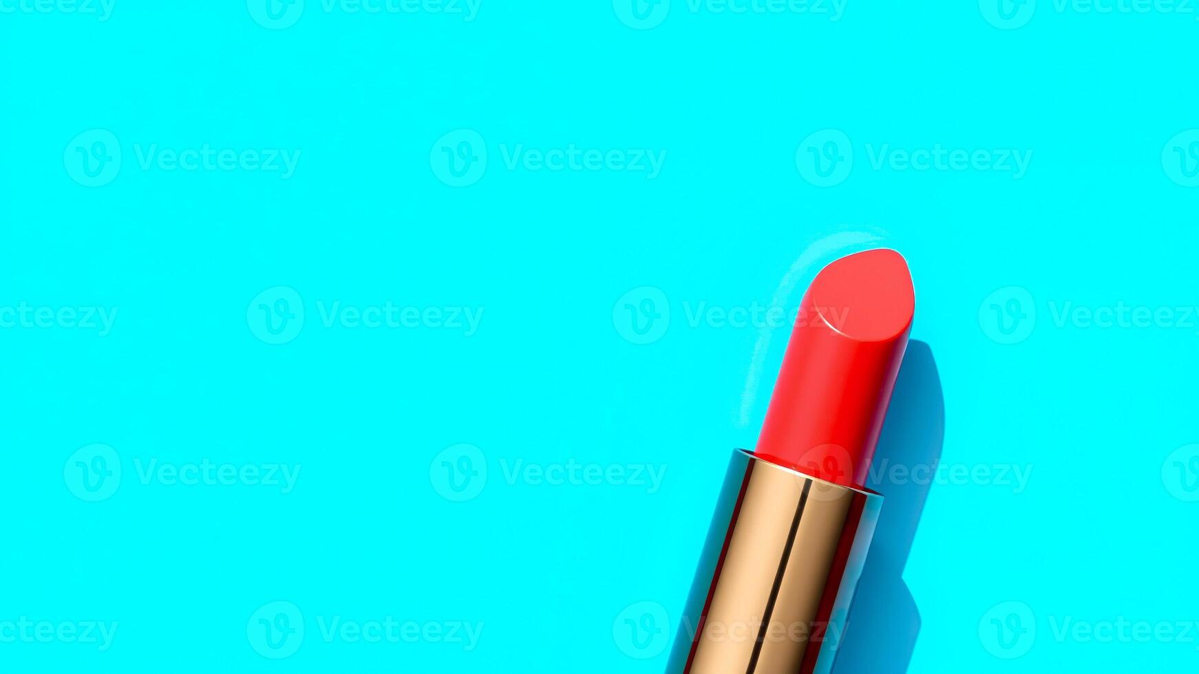 red lipstick with a golden casing photo