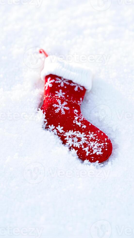 red stocking with snowflakes lies the snow photo