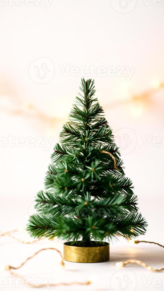 small artificial tree with golden lights photo