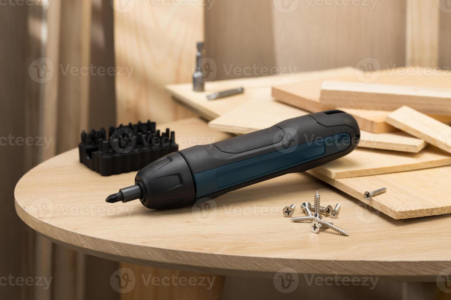 The image showcases a mini handheld cordless screwdriver, ideal for quick DIY tasks. photo