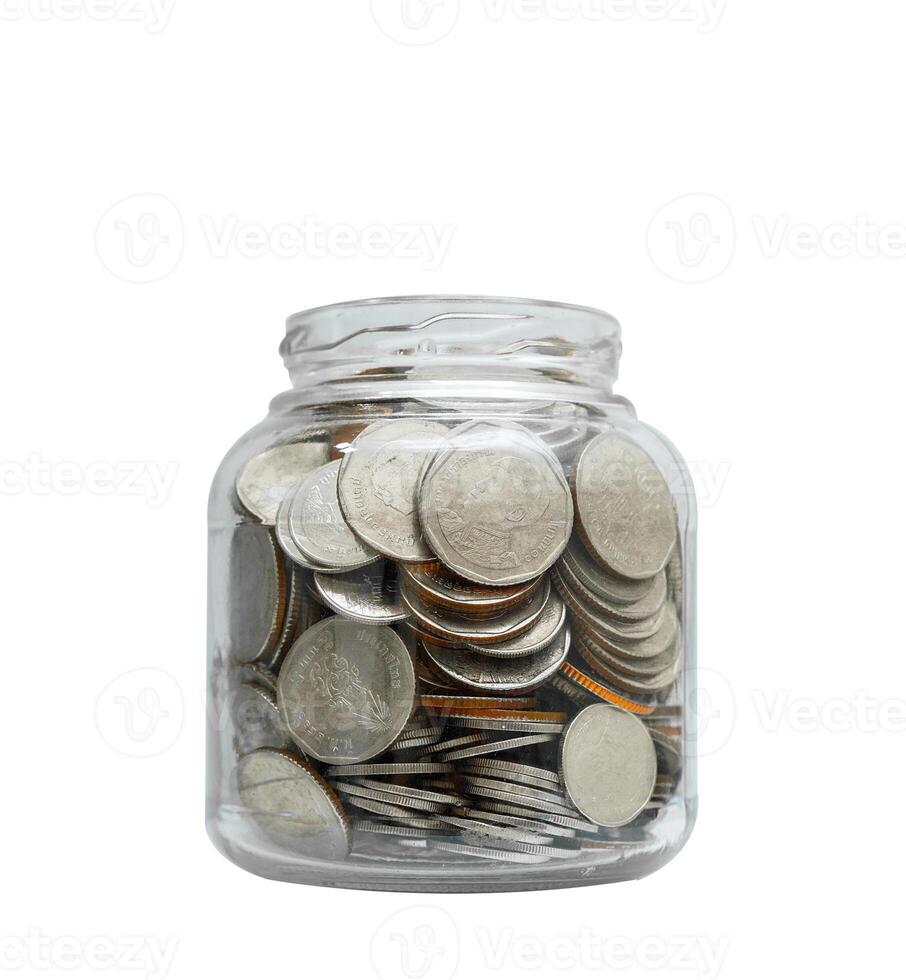 Plant growing with coins in glass bottle isolated on white background. photo