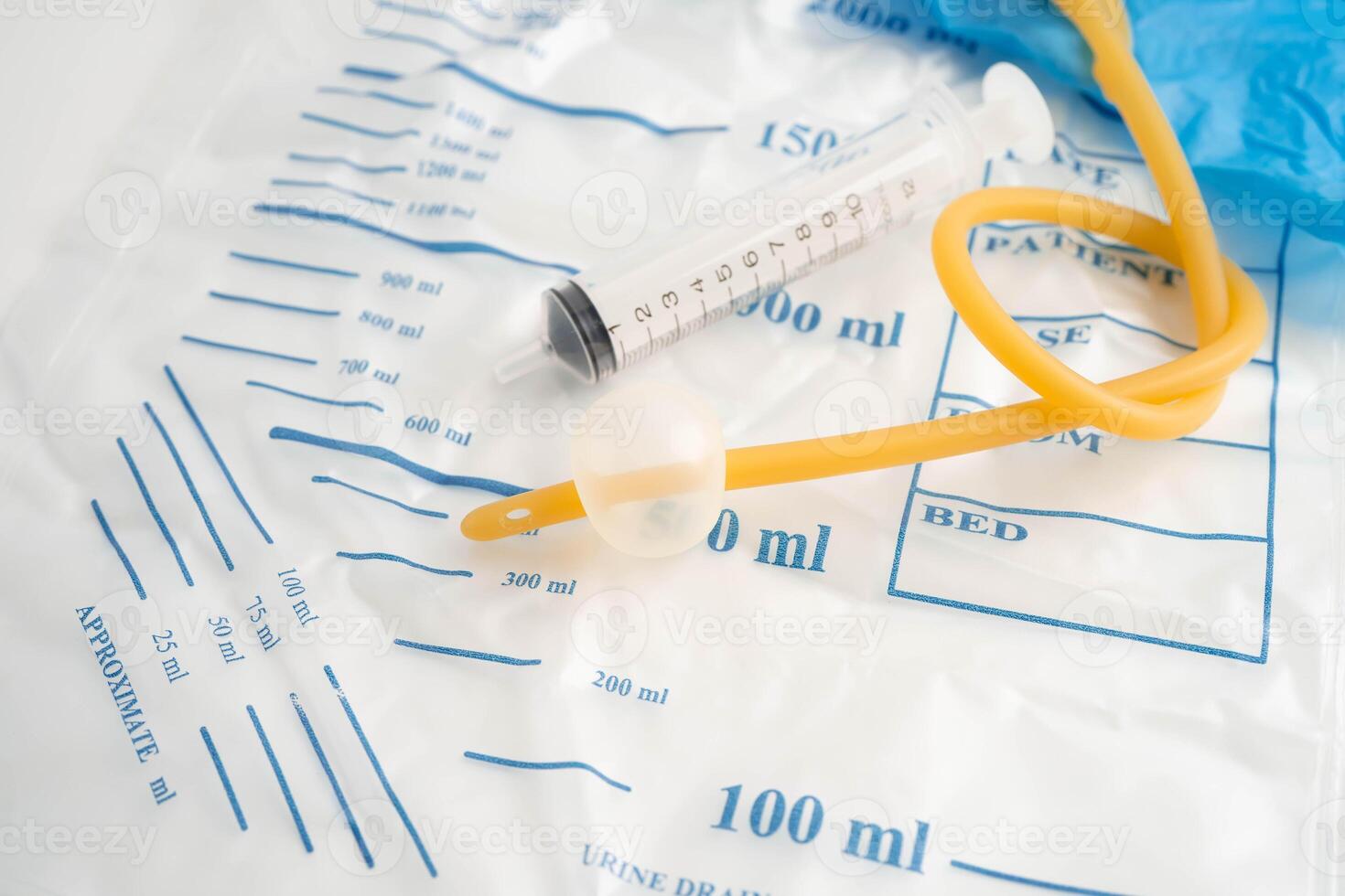 Foley catheter and urine drainage bag collect urine for disability or patient in hospital. photo