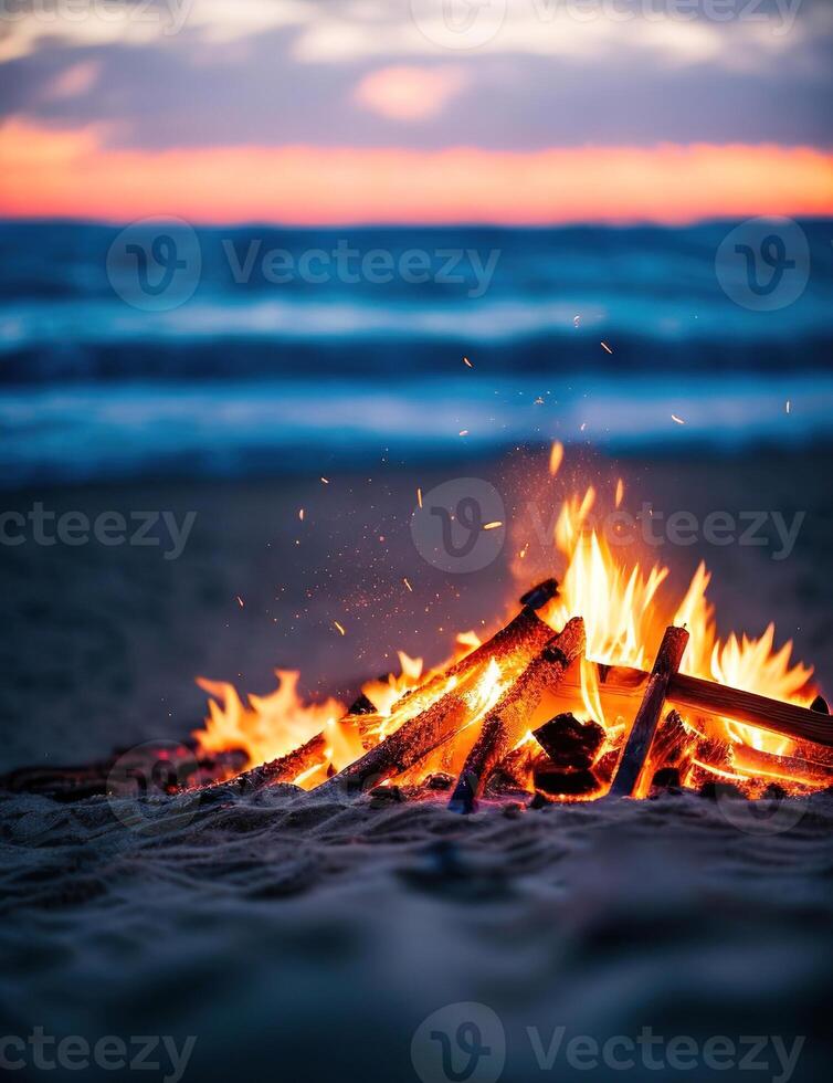 A bonfire on the beach at sunset photo